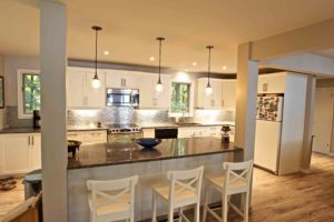 home renovation - kitchen island with pendant lighting and stools