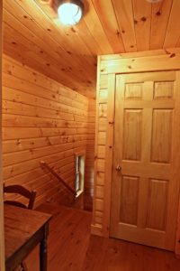 Stoney Lake island cottage renovation - walking out of bunkie into cottage